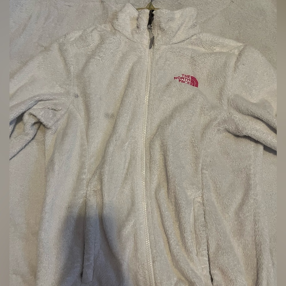 White and pink northface jacket